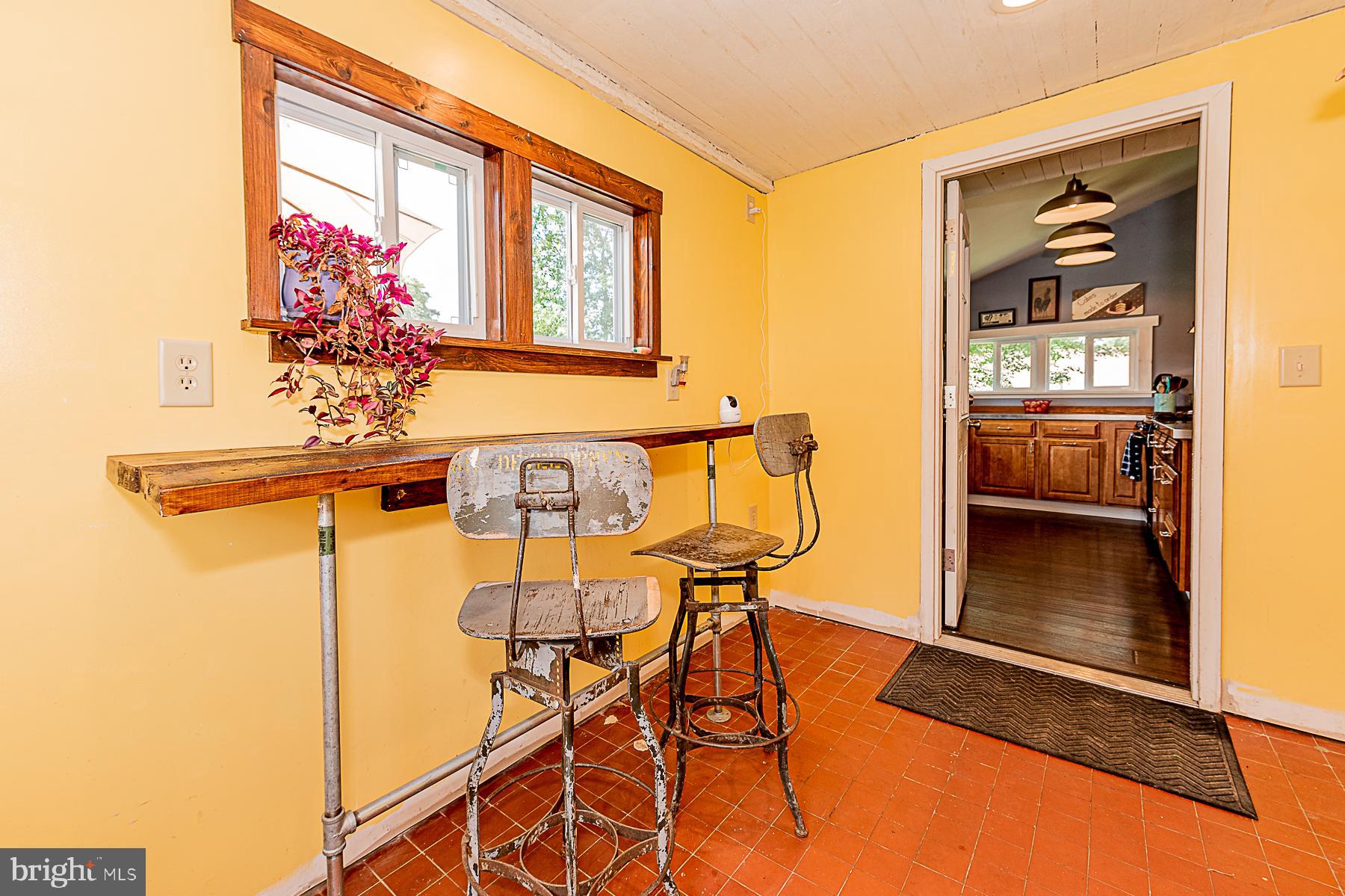 77 Love Run Road Colora, MD 21917 - Photo 15 of 43 a view of a dining room with furniture and chandelier