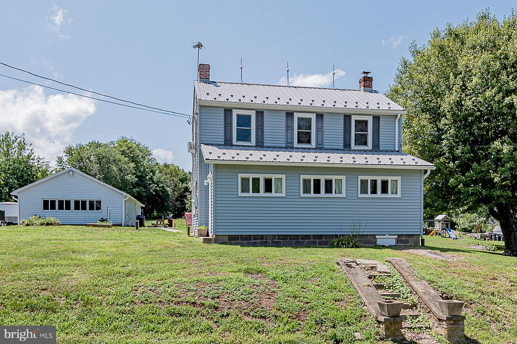 77 Love Run Road Colora, MD 21917 - Photo 3 of 43 a front view of a house with garden