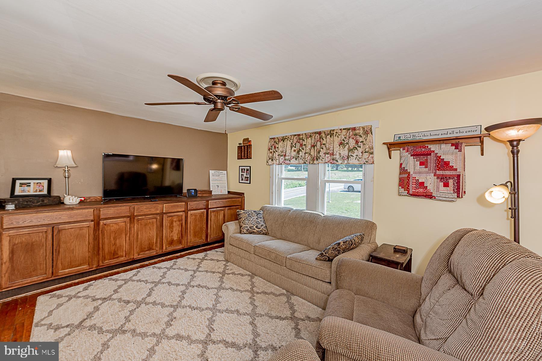 77 Love Run Road Colora, MD 21917 - Photo 28 of 43 a living room with furniture and a flat screen tv