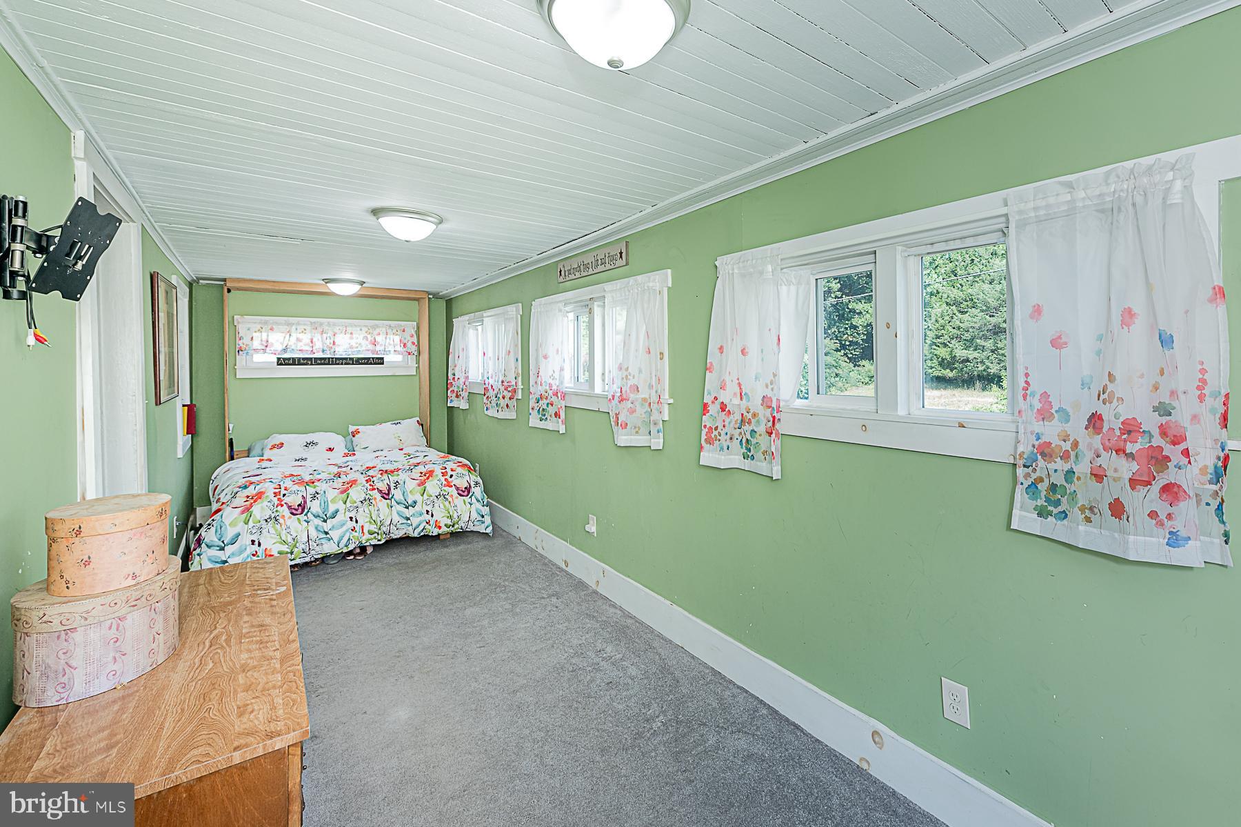 77 Love Run Road Colora, MD 21917 - Photo 30 of 43 a bedroom with furniture and a large window