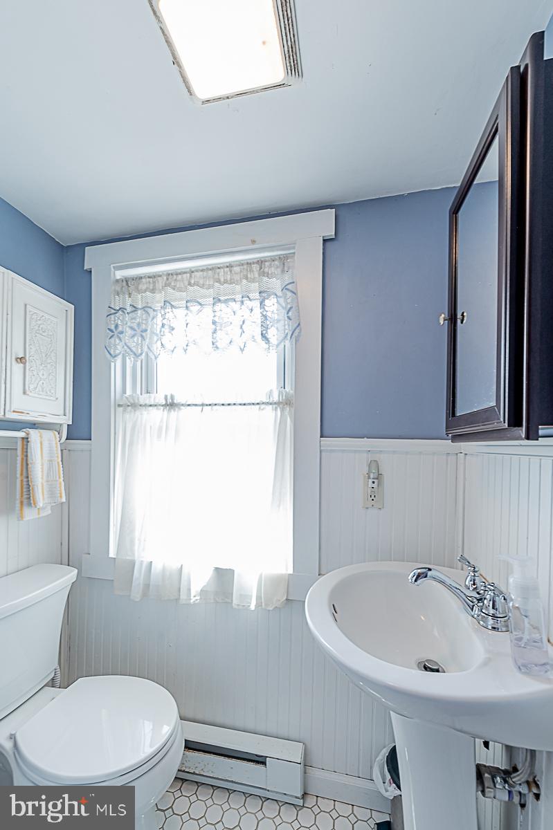77 Love Run Road Colora, MD 21917 - Photo 34 of 43 a bathroom with a sink a window and a toilet