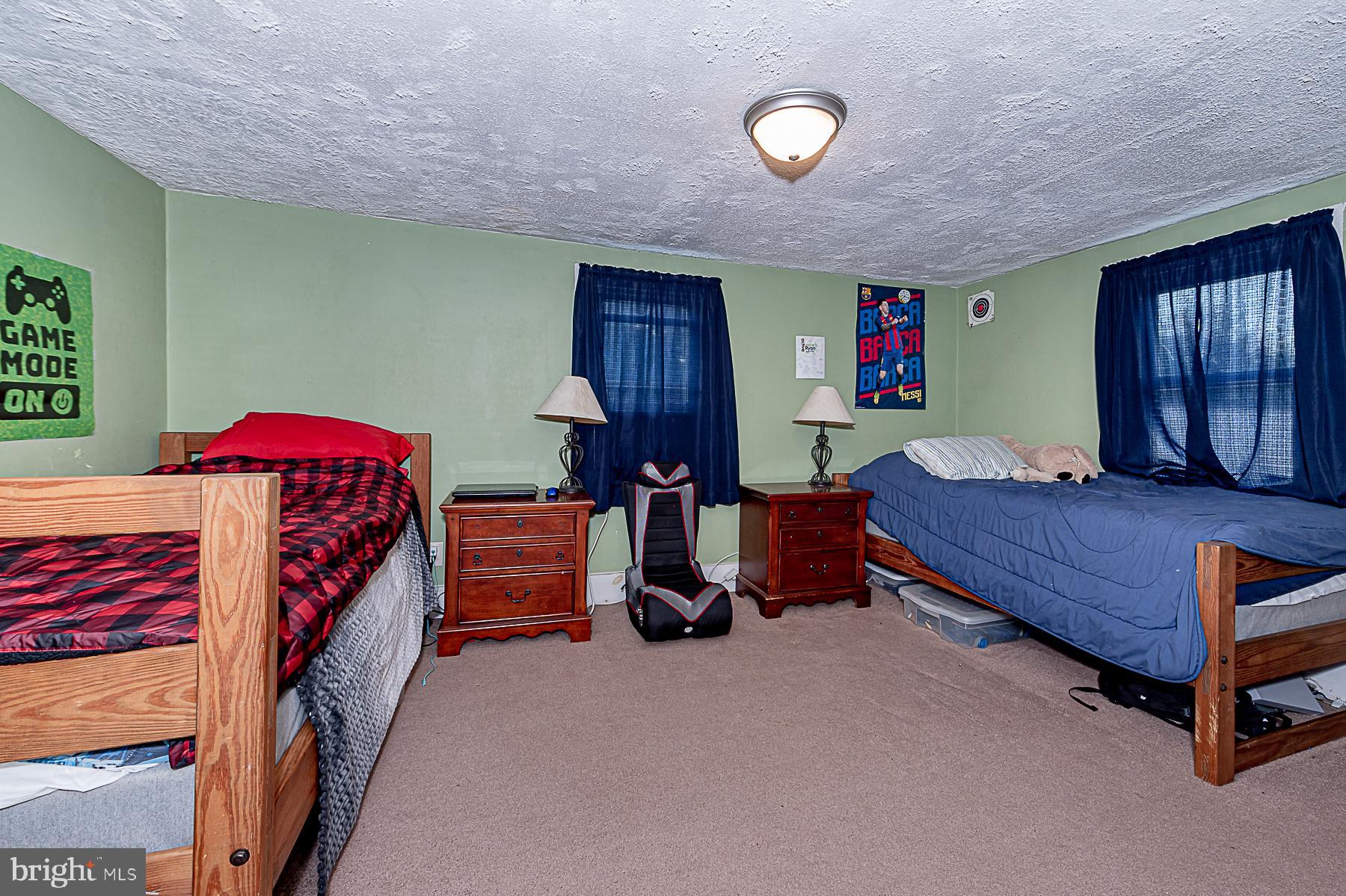 77 Love Run Road Colora, MD 21917 - Photo 37 of 43 a bedroom with furniture and a chandelier