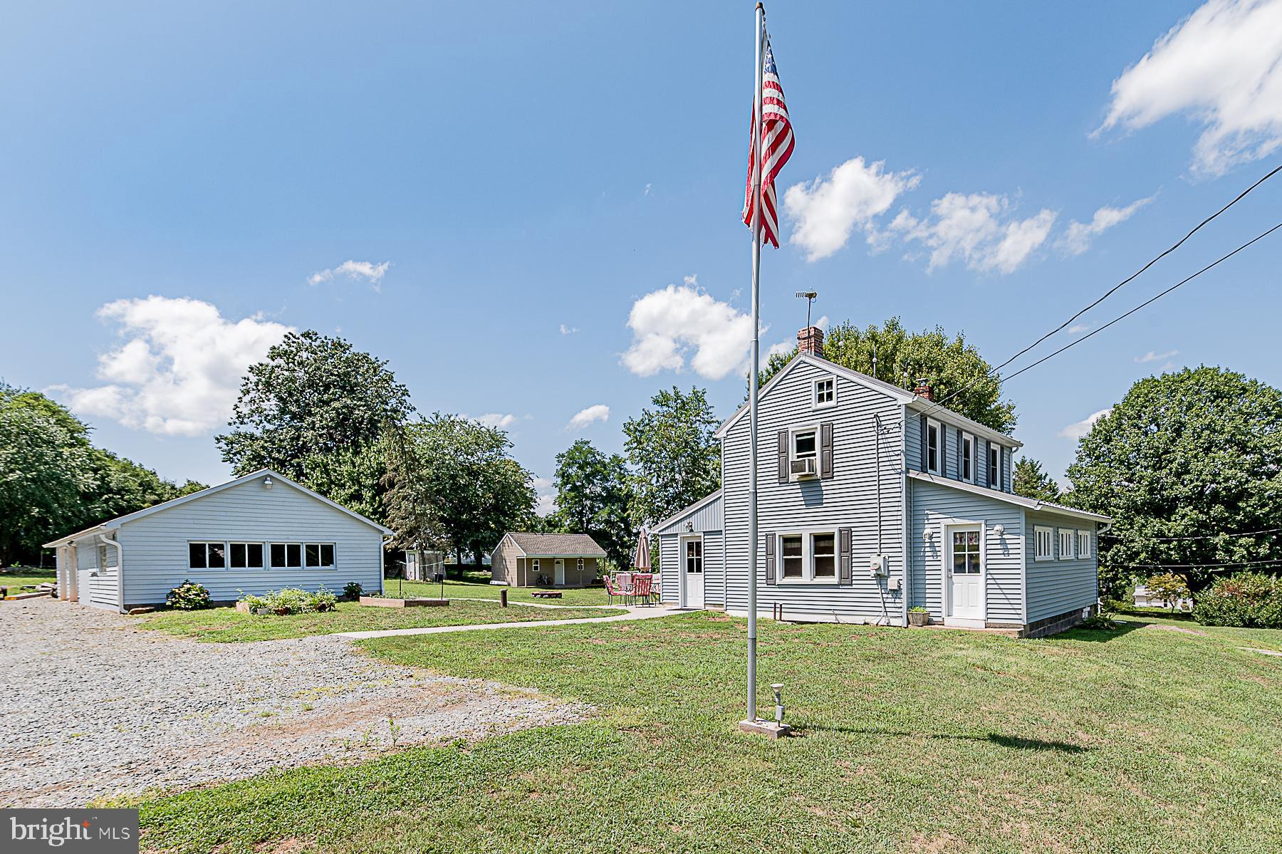 77 Love Run Road Colora, MD 21917 - Photo 5 of 43 a front view of a house with a yard and garage