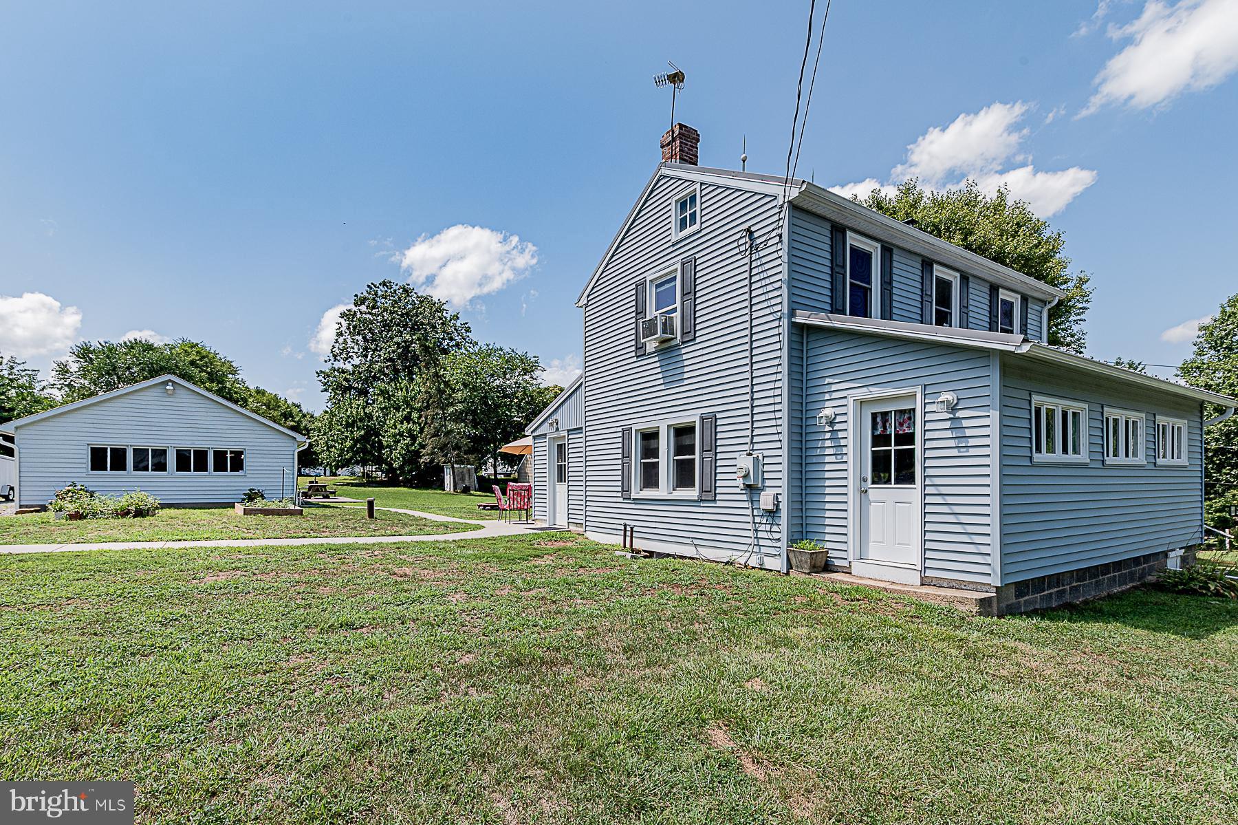 77 Love Run Road Colora, MD 21917 - Photo 8 of 43 a front view of a house with a garden