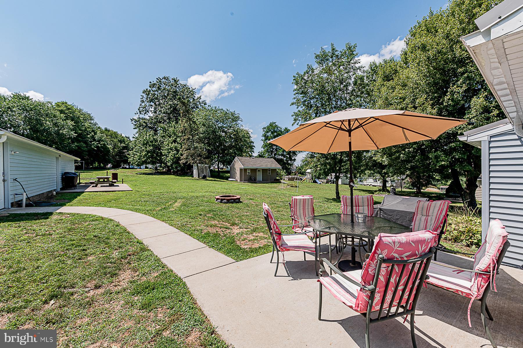 77 Love Run Road Colora, MD 21917 - Photo 9 of 43 a view of backyard with seating space and trees