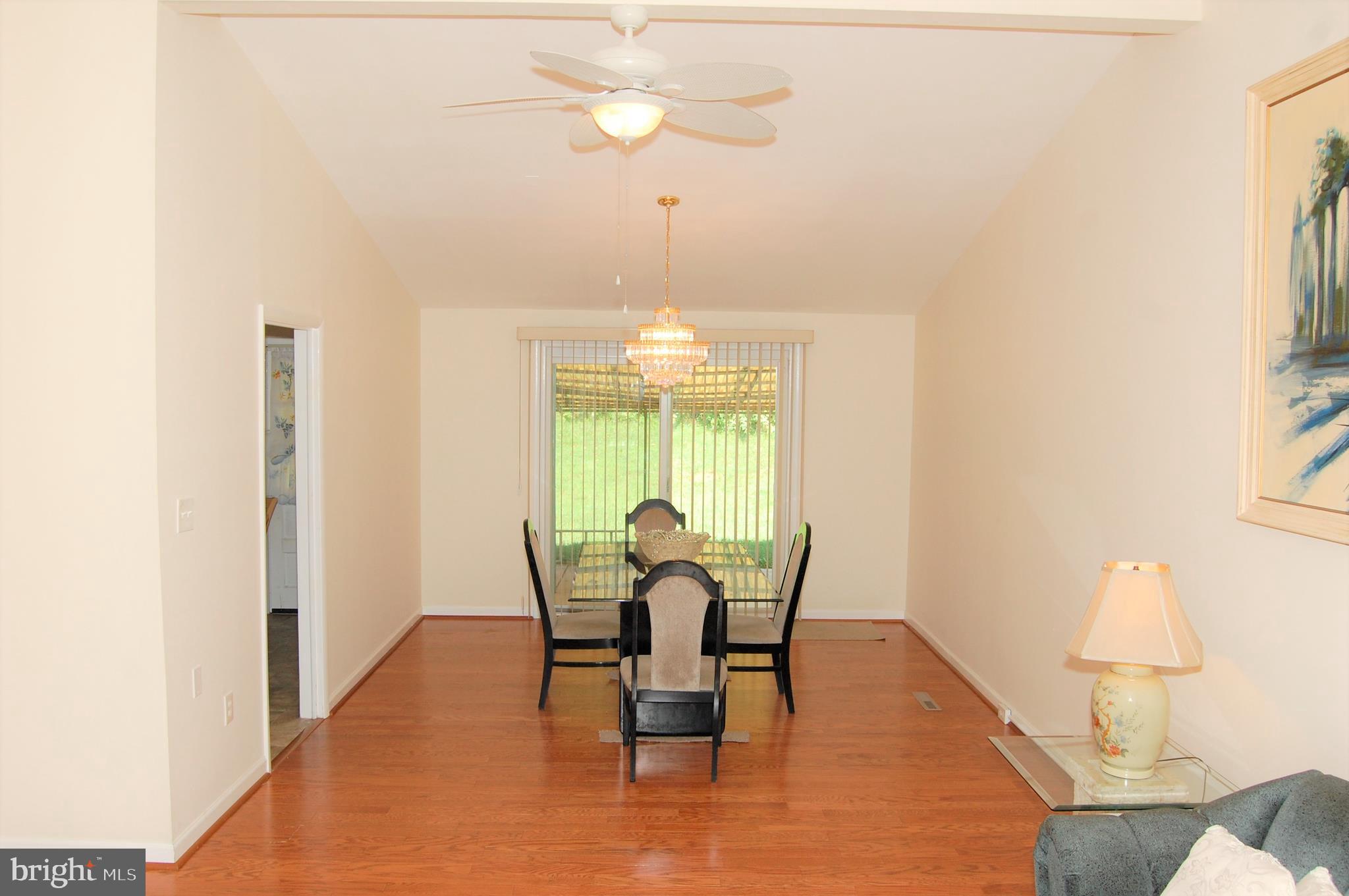 818 Hopewood Road Pikesville, MD 21208 - Photo 4 of 24 Dining Room w/Cathedral Ceilings & SGD To Patio