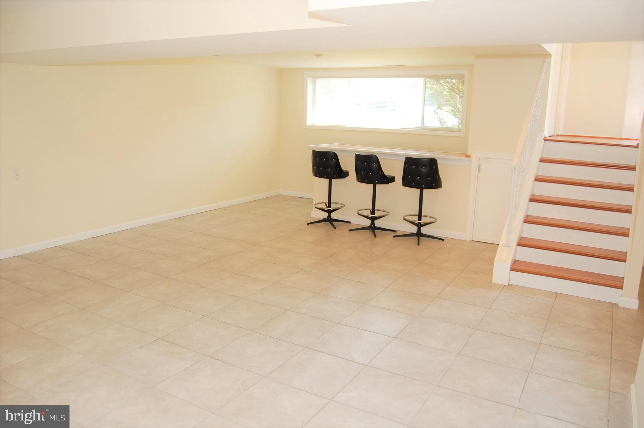 818 Hopewood Road Pikesville, MD 21208 - Photo 8 of 24 Finished Lower Level w/Ceramic Flooring & Bar