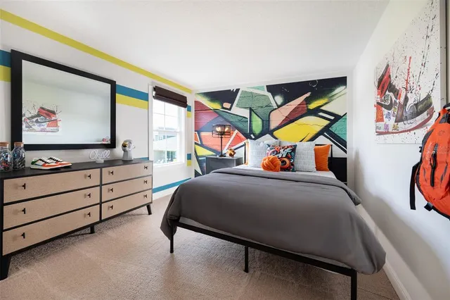 a bedroom with a bed and a cabinets