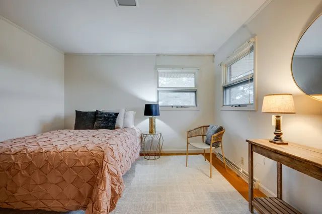 a bedroom with double bed and a window