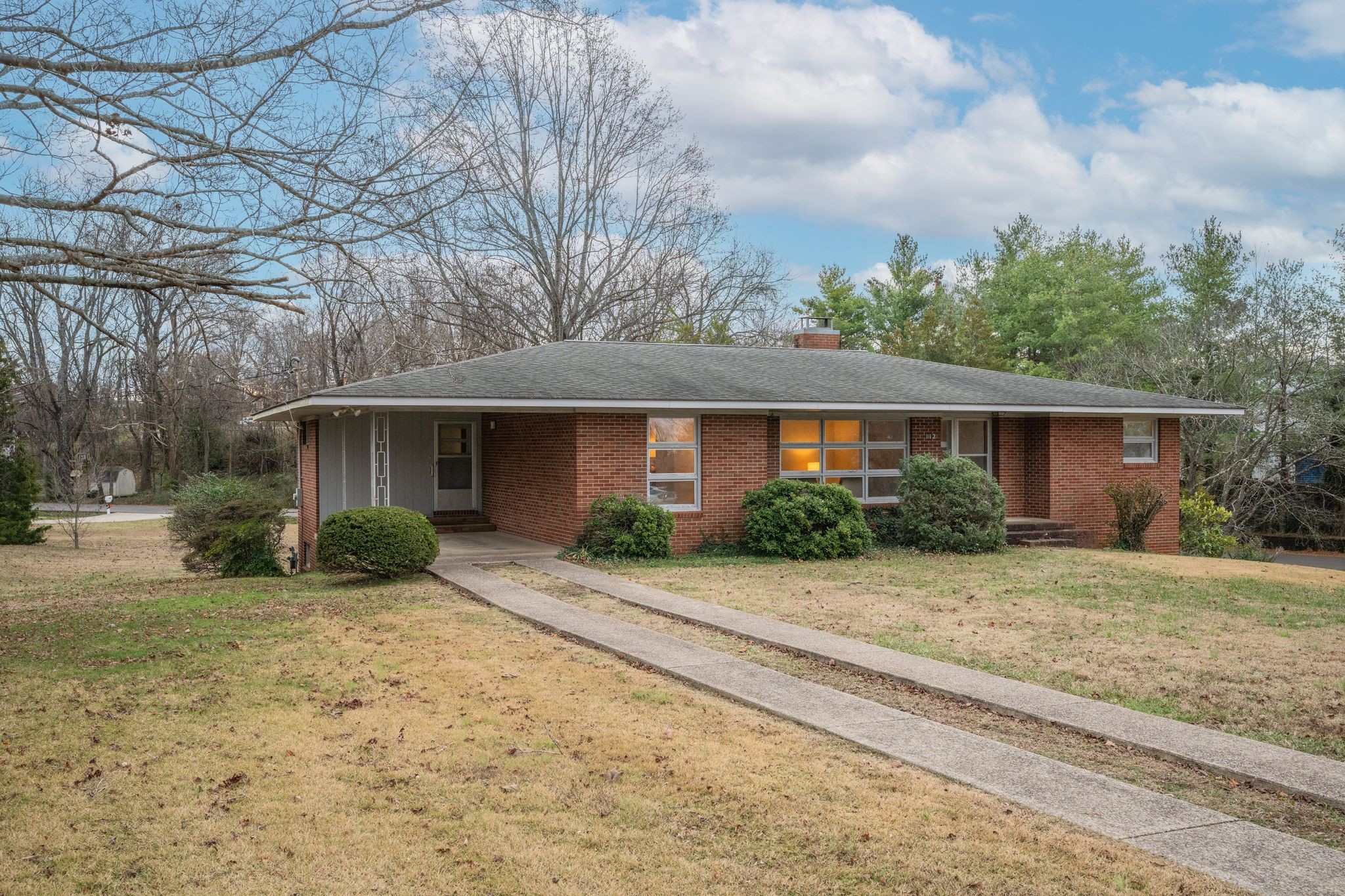 112 Lake Valley Road Dickson, TN 37055 - Photo 2 of 46 a front view of a house with a yard and potted plants
