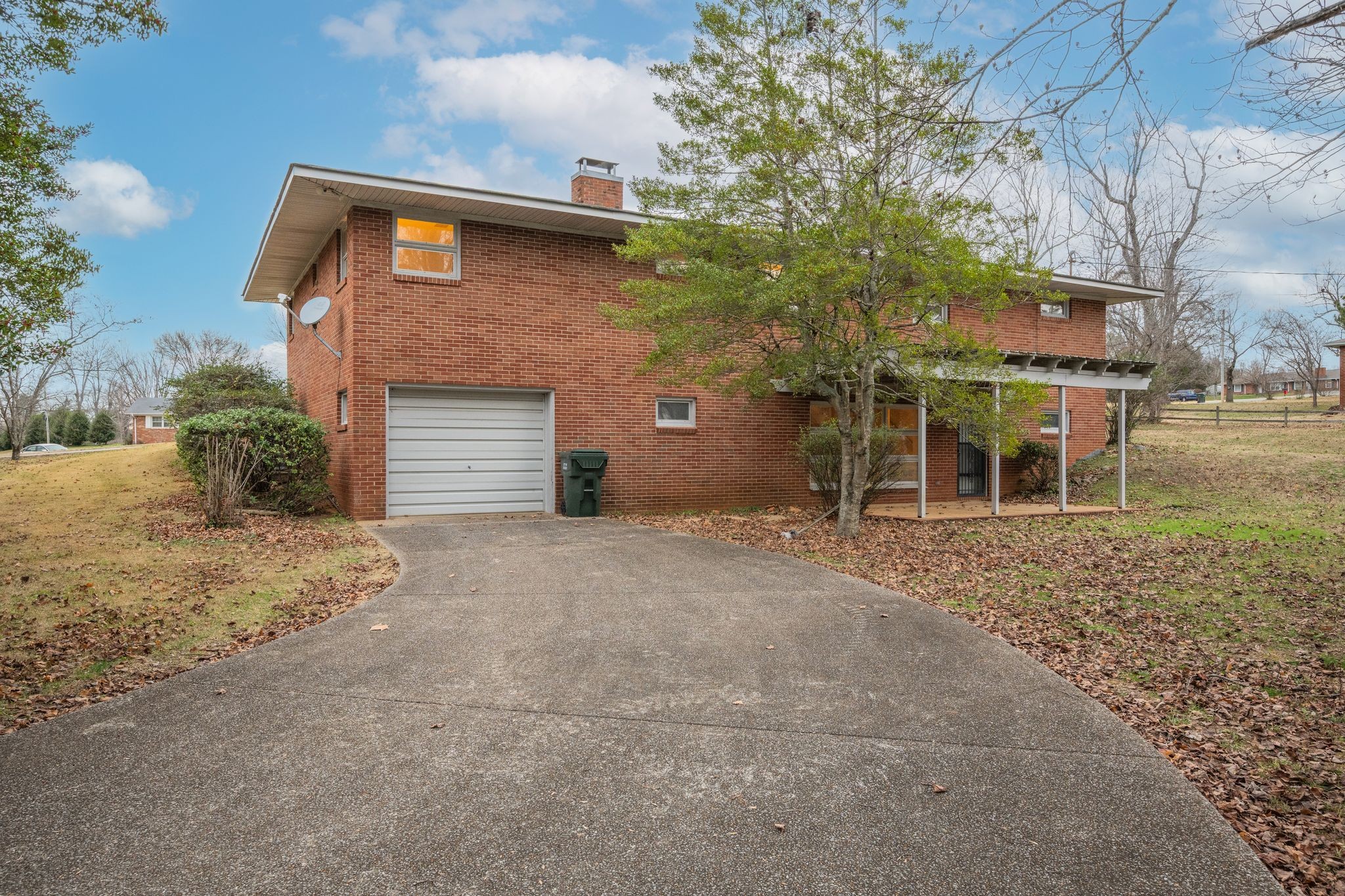 112 Lake Valley Road Dickson, TN 37055 - Photo 35 of 46 a front view of a house with a yard and garage