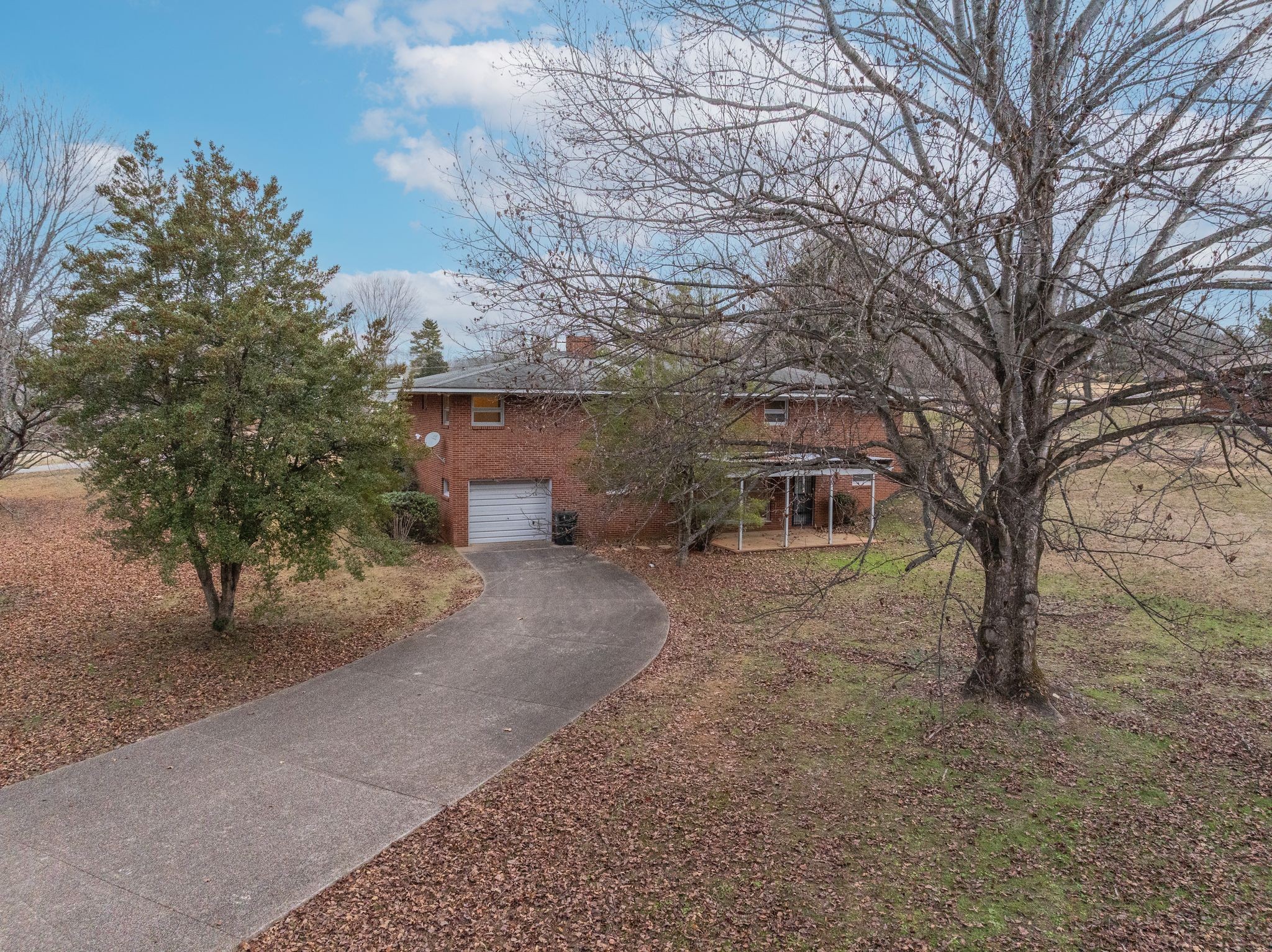 112 Lake Valley Road Dickson, TN 37055 - Photo 44 of 46 a front view of a house with a yard and garage