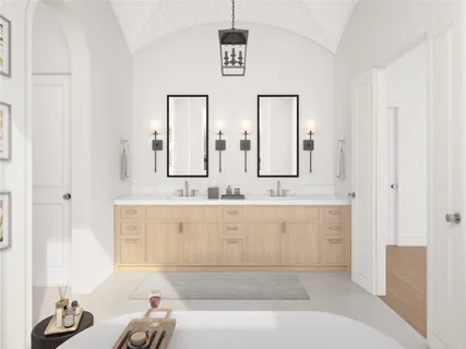 a bathroom with sinks mirror and bathtub