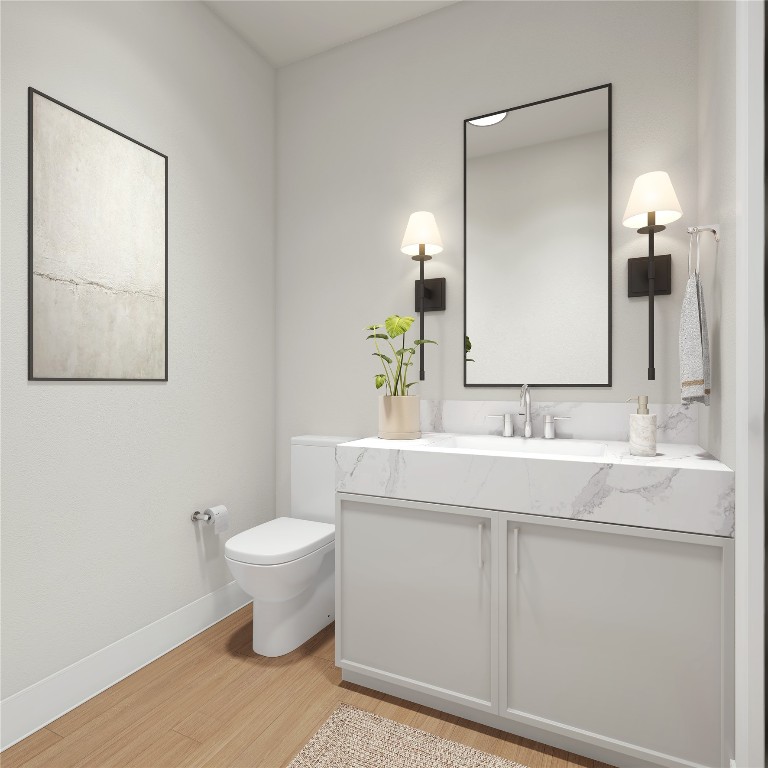 830 East 27th Street Houston, TX 77009 - Photo 19 of 27 a bathroom with a toilet sink and mirror