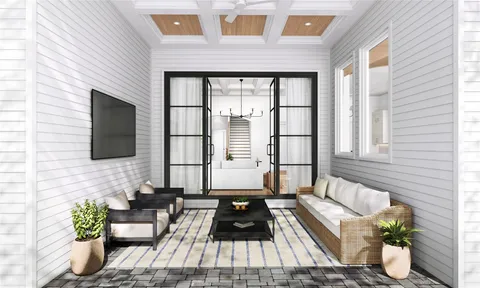 a living room filled with furniture and a flat screen tv