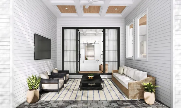 a living room filled with furniture and a flat screen tv