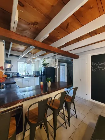 a dining room with furniture and window