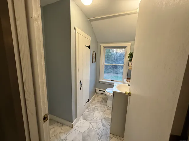 a bathroom with a tub and shower