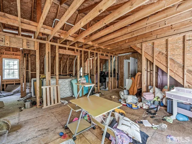 a view of a house with backyard porch and sitting area