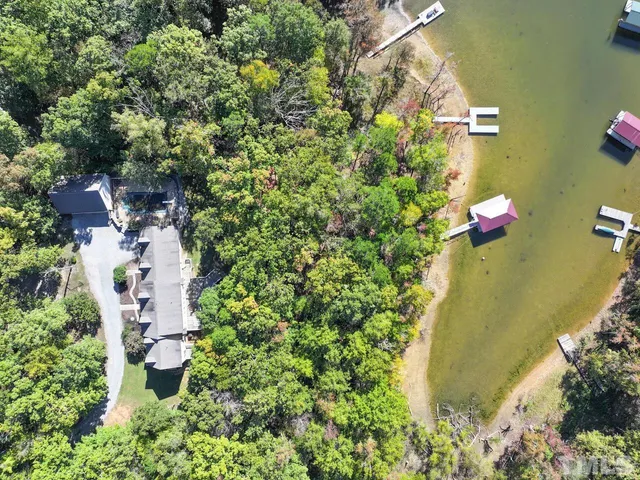 a aerial view of a house with swimming pool and sitting area