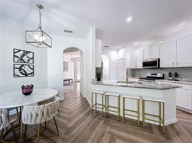 a view of dining table and chairs in a kitchen
