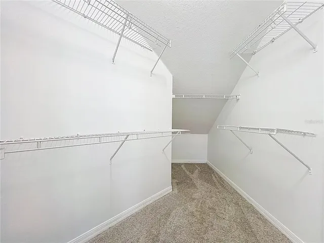 a view of a room with racks on the wall