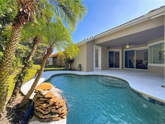 a view of a backyard of the house