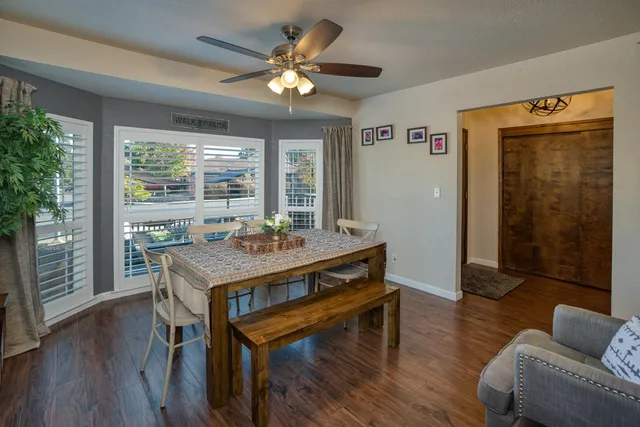 a view of a livingroom with furniture window and wooden floor