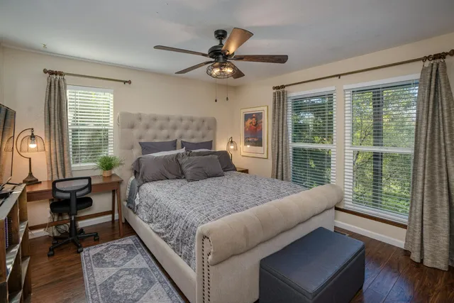 a bed room with a bed and a window