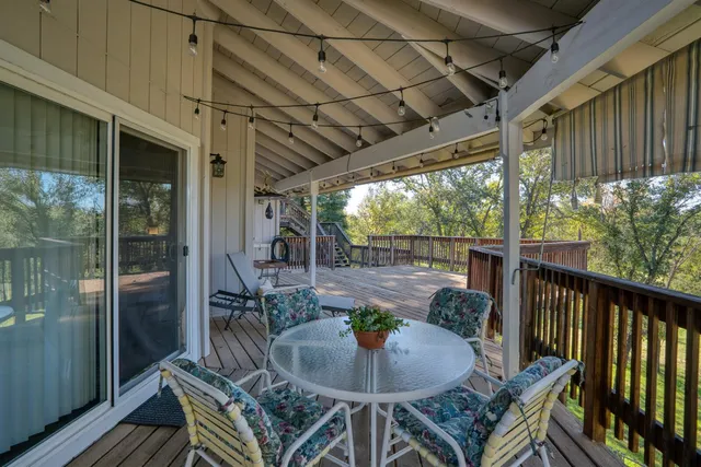 a outdoor dining space with furniture and outdoor view