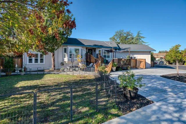 a backyard of a house with lots of green space