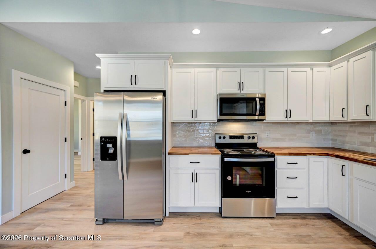 119 Prospect Avenue Scranton, PA 18505 - Photo 11 of 43 a kitchen with stainless steel appliances granite countertop a refrigerator and a stove top oven