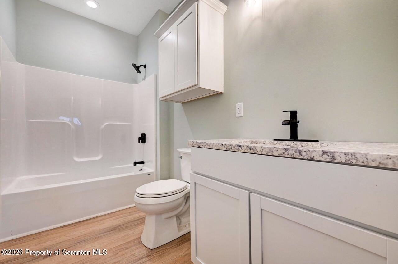 119 Prospect Avenue Scranton, PA 18505 - Photo 14 of 43 a bathroom with a sink a toilet and a bathtub
