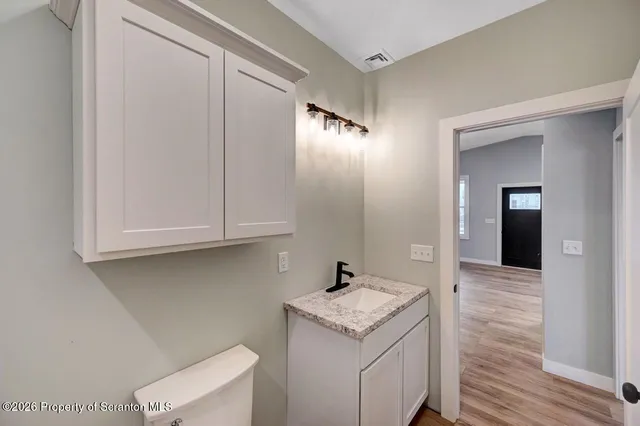 a bathroom with a sink and mirror