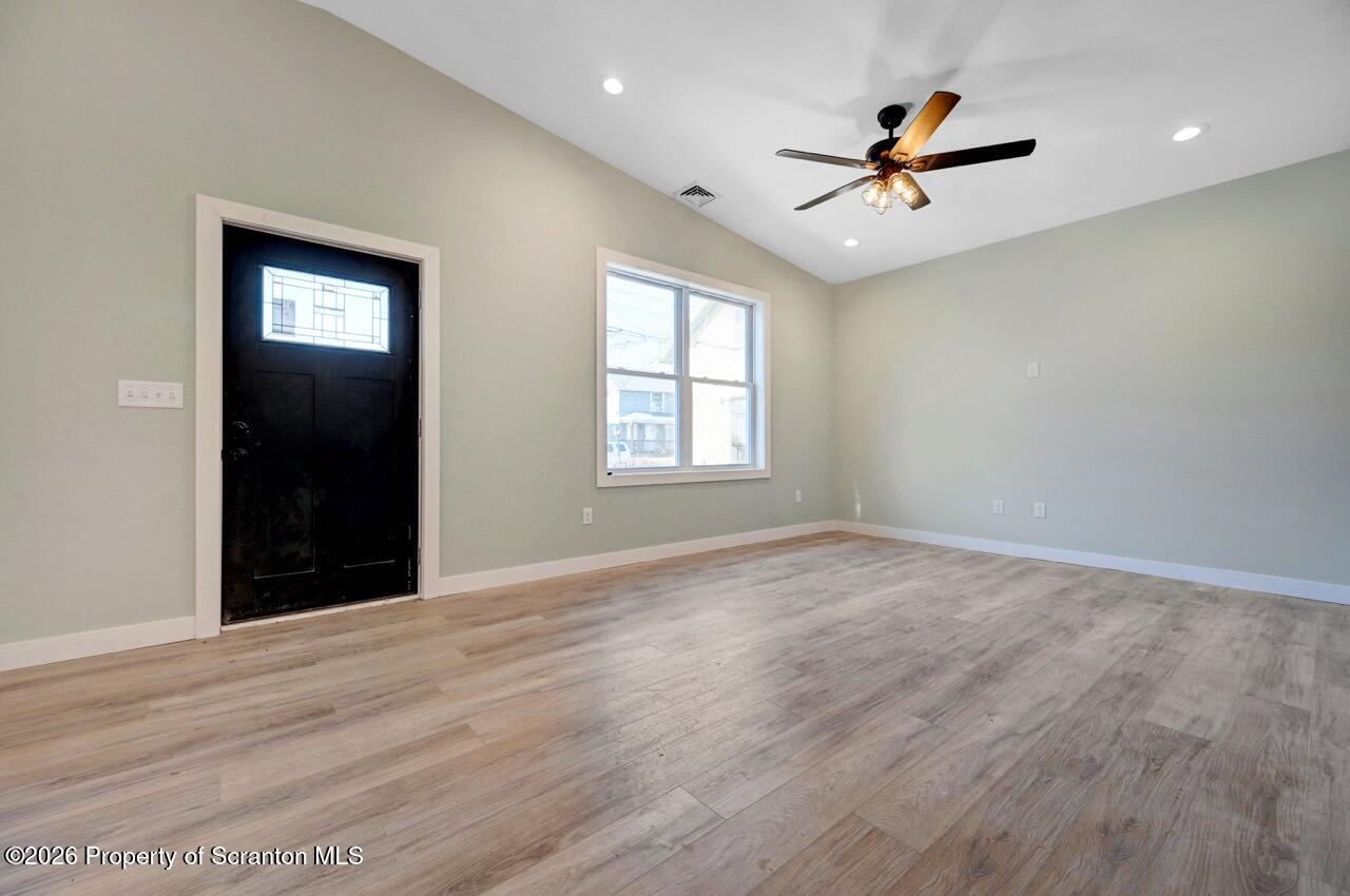 119 Prospect Avenue Scranton, PA 18505 - Photo 2 of 43 a view of an empty room with window and wooden floor