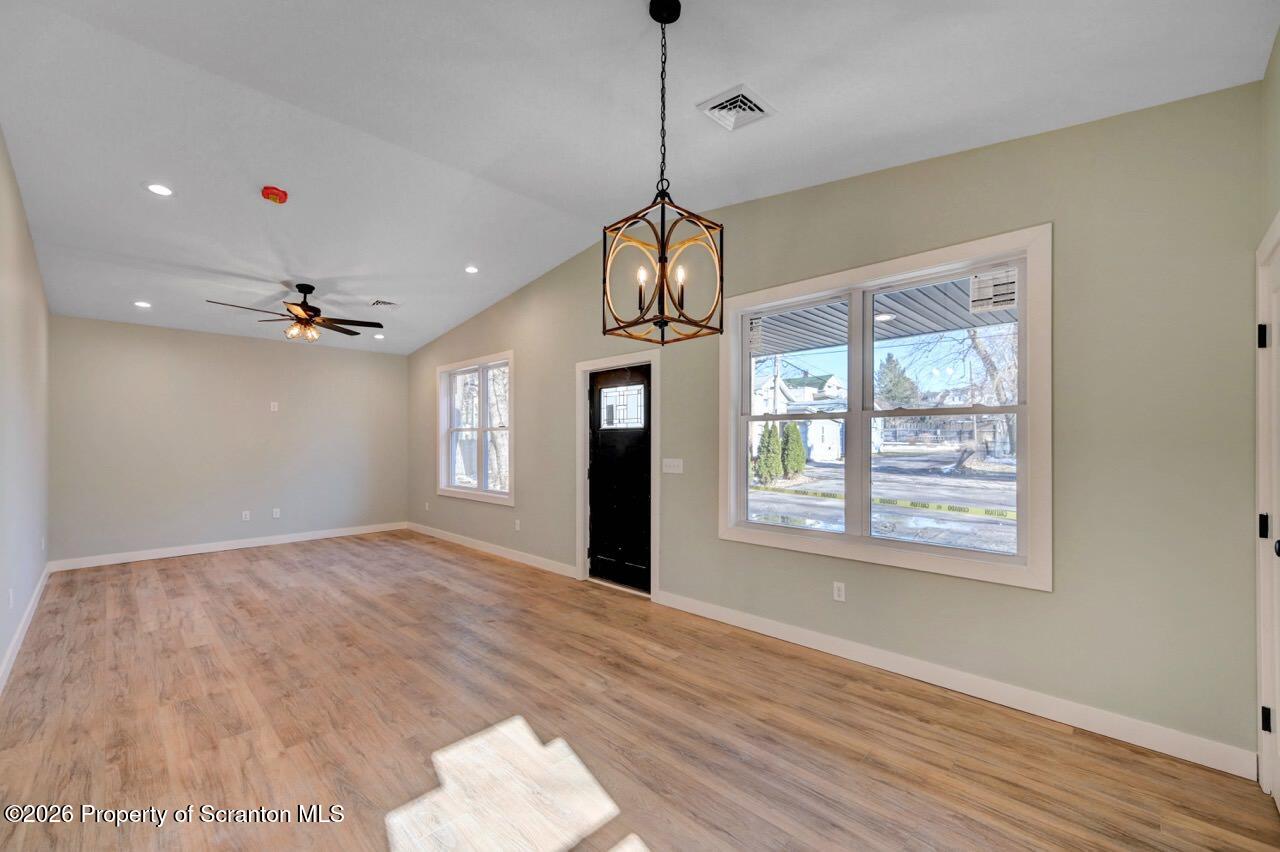 119 Prospect Avenue Scranton, PA 18505 - Photo 22 of 43 a view of an empty room with window and wooden floor