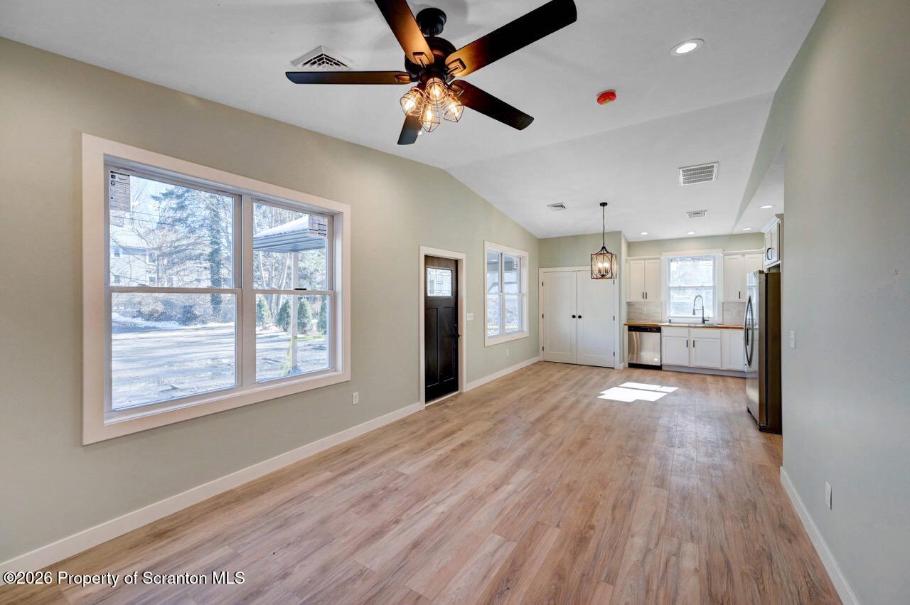 119 Prospect Avenue Scranton, PA 18505 - Photo 26 of 43 a view of an empty room with a window and wooden floor