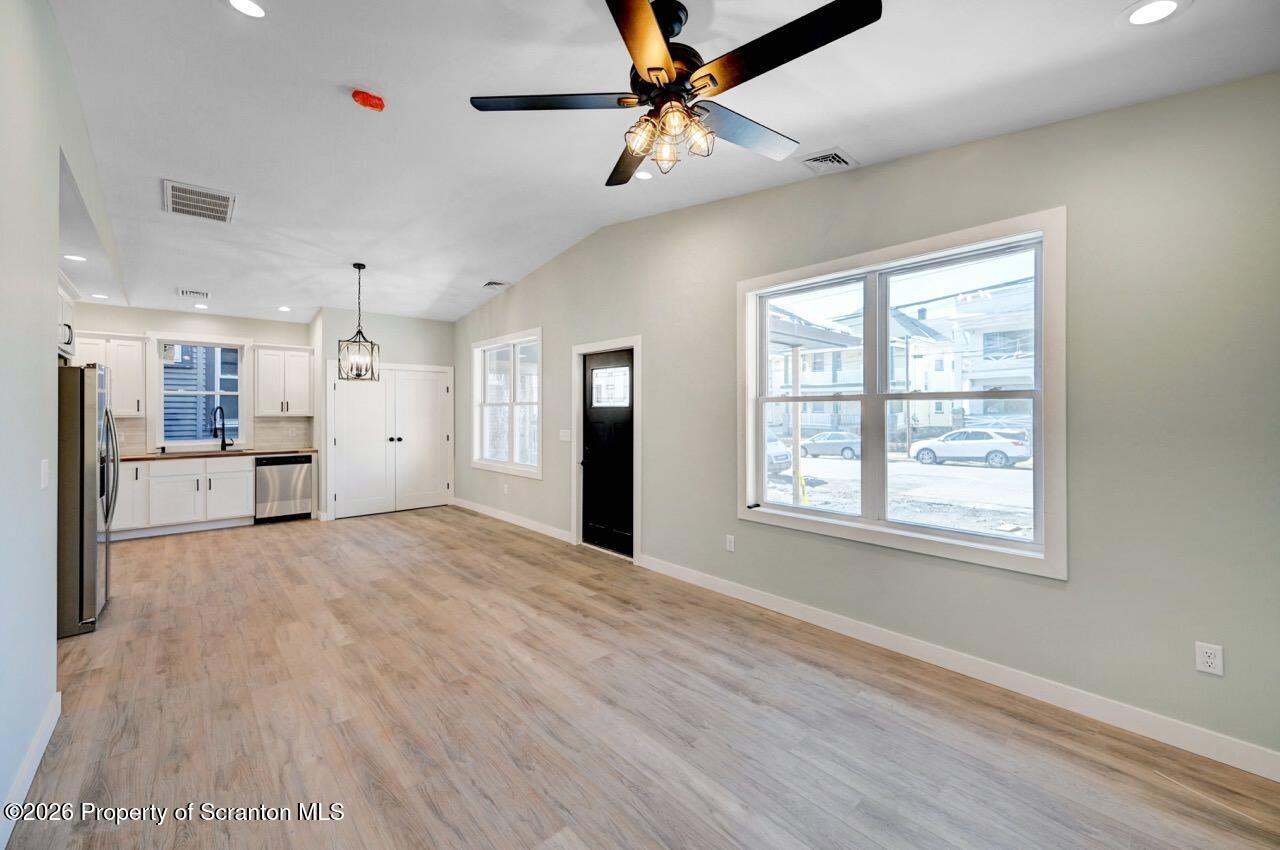 119 Prospect Avenue Scranton, PA 18505 - Photo 5 of 43 a view of an empty room with a window and kitchen view