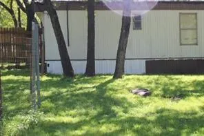 a view of backyard with tub