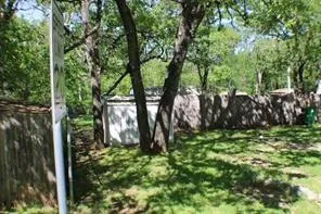 a backyard of a house with lots of green space