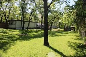 a view of swimming pool from a yard