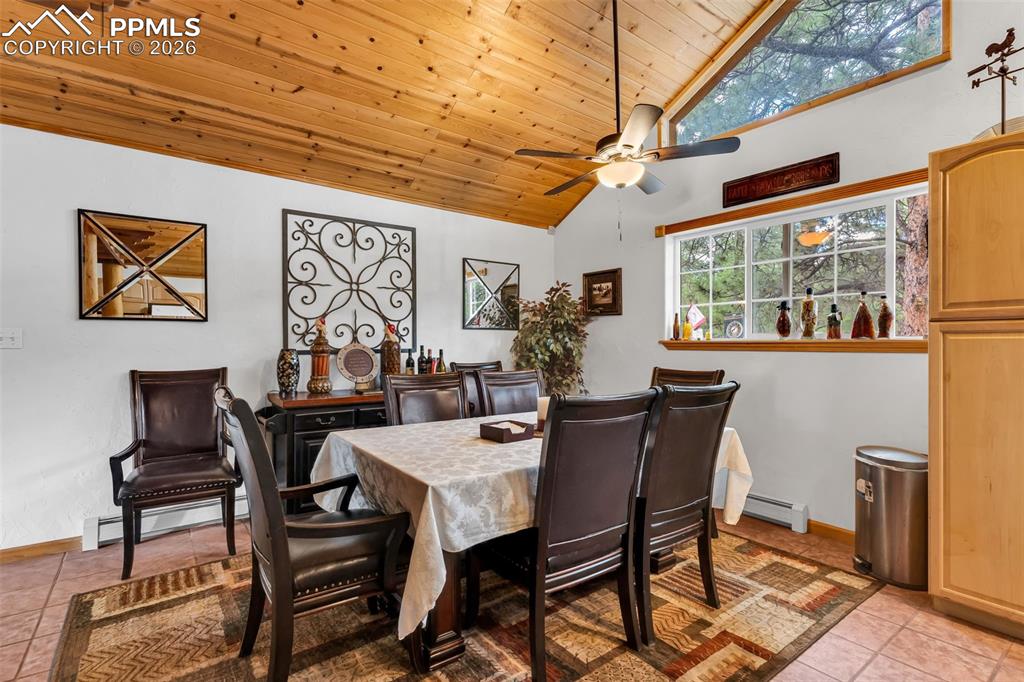 209 Rosewood Road Westcliffe, CO 81252 - Photo 10 of 49 Tile floor, ceiling fan, and plenty of natural light in dining area next to kitchen