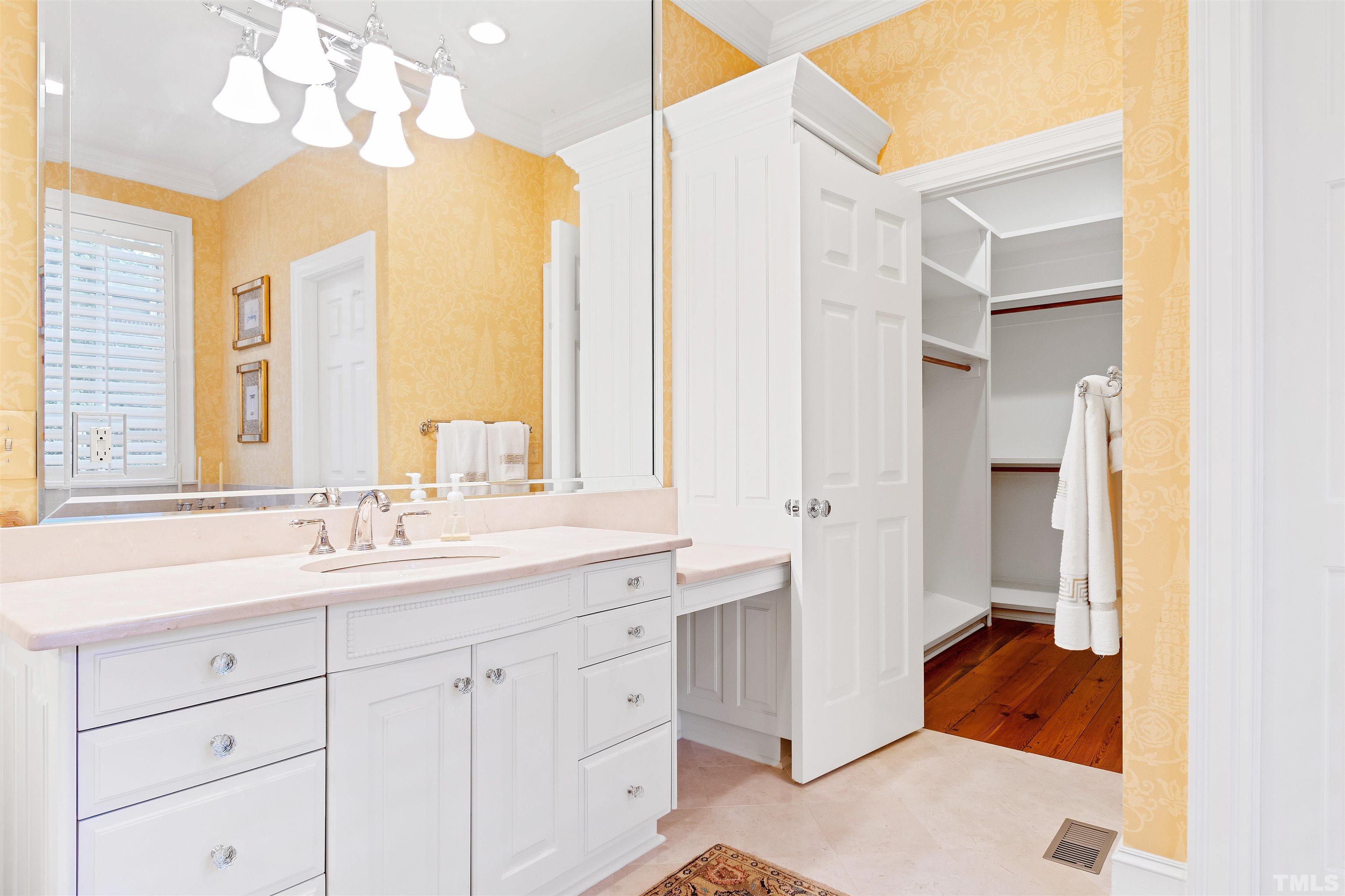 1029 Harvey Street Raleigh, NC 27608 - Photo 27 of 63 a en suite bathroom with a double vanity sink mirror and next to a window