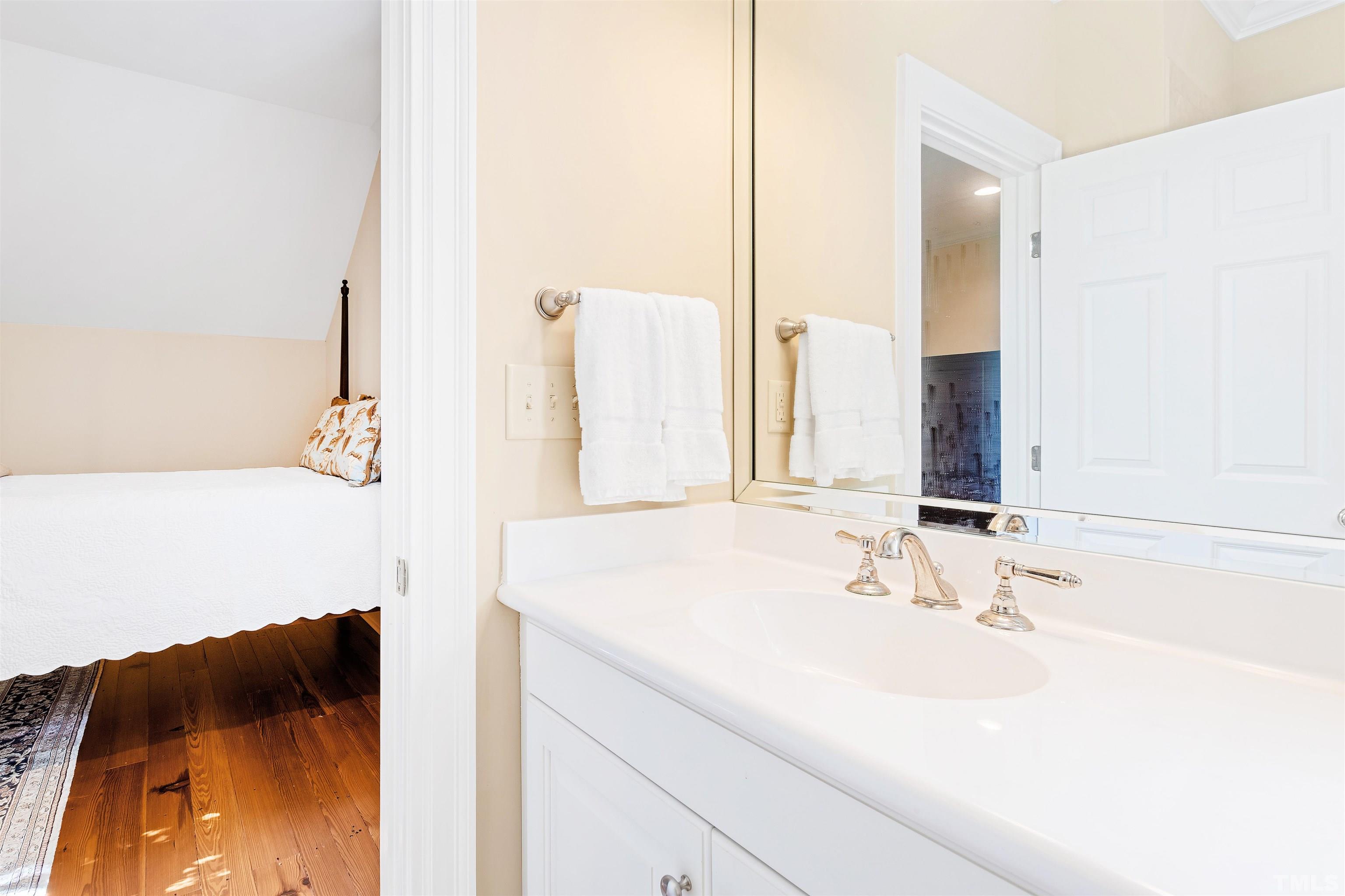 1029 Harvey Street Raleigh, NC 27608 - Photo 40 of 63 a bathroom with a sink and a mirror