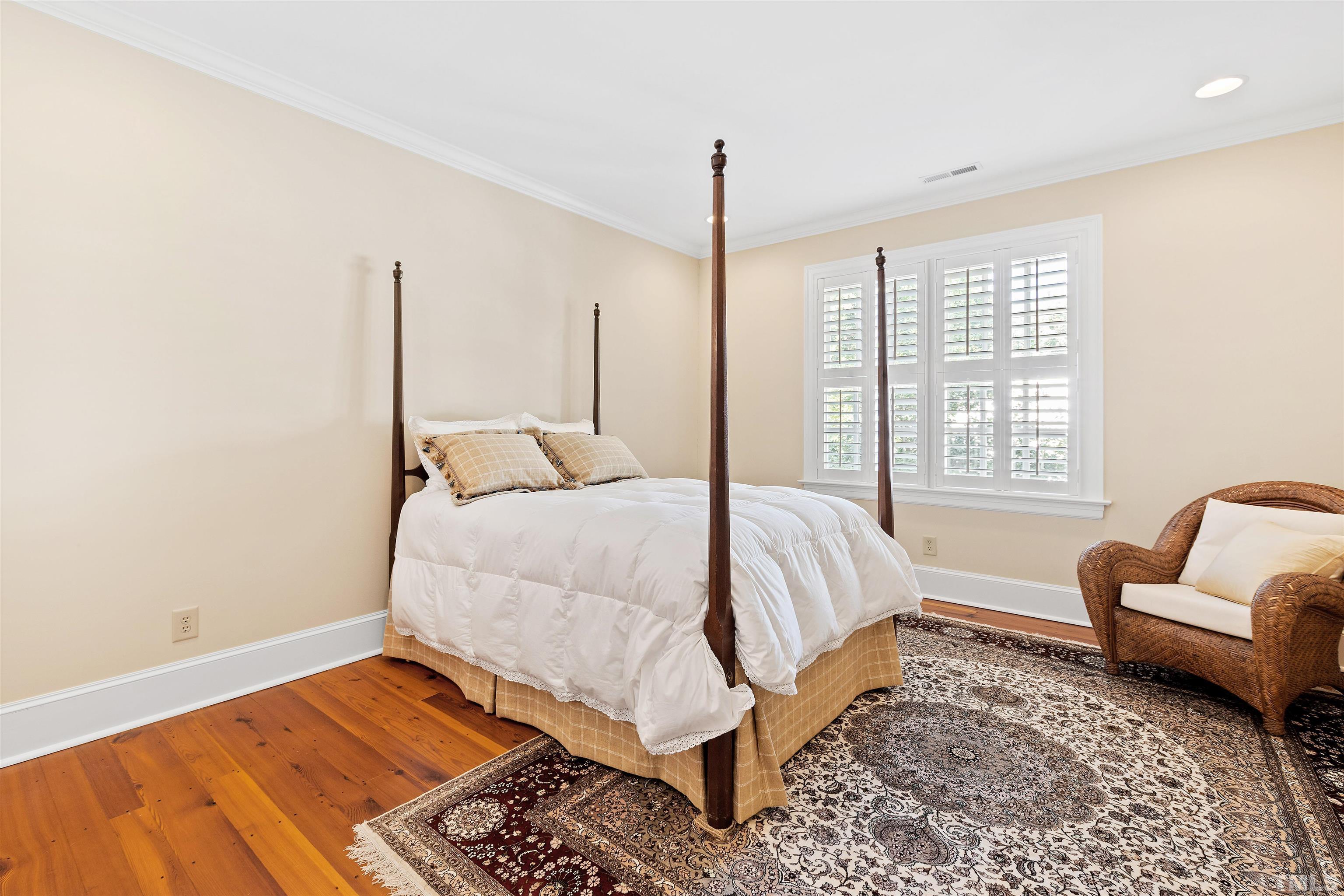 1029 Harvey Street Raleigh, NC 27608 - Photo 42 of 63 a bed room with a bed and a couch