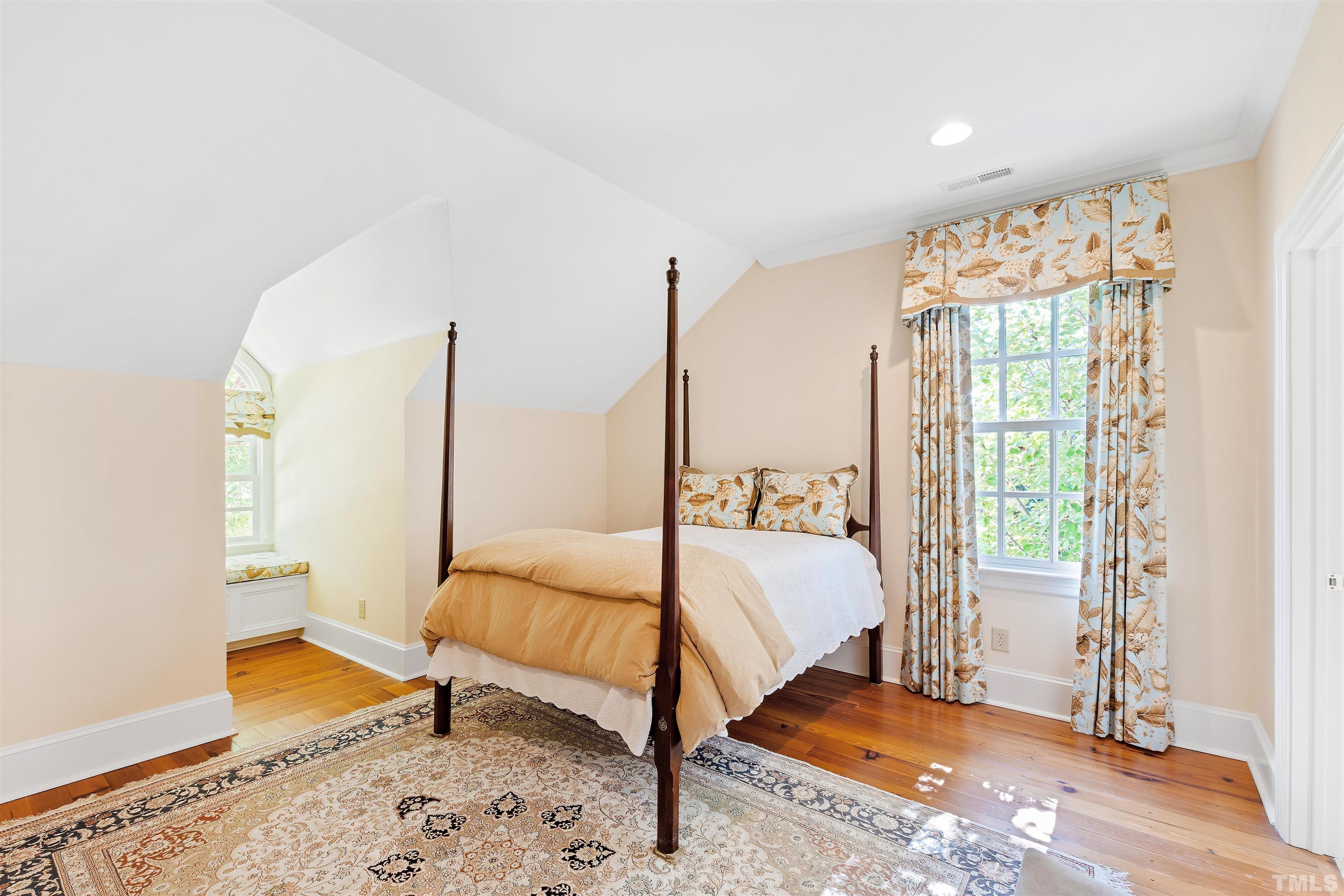 1029 Harvey Street Raleigh, NC 27608 - Photo 43 of 63 a bedroom with a bed and a window