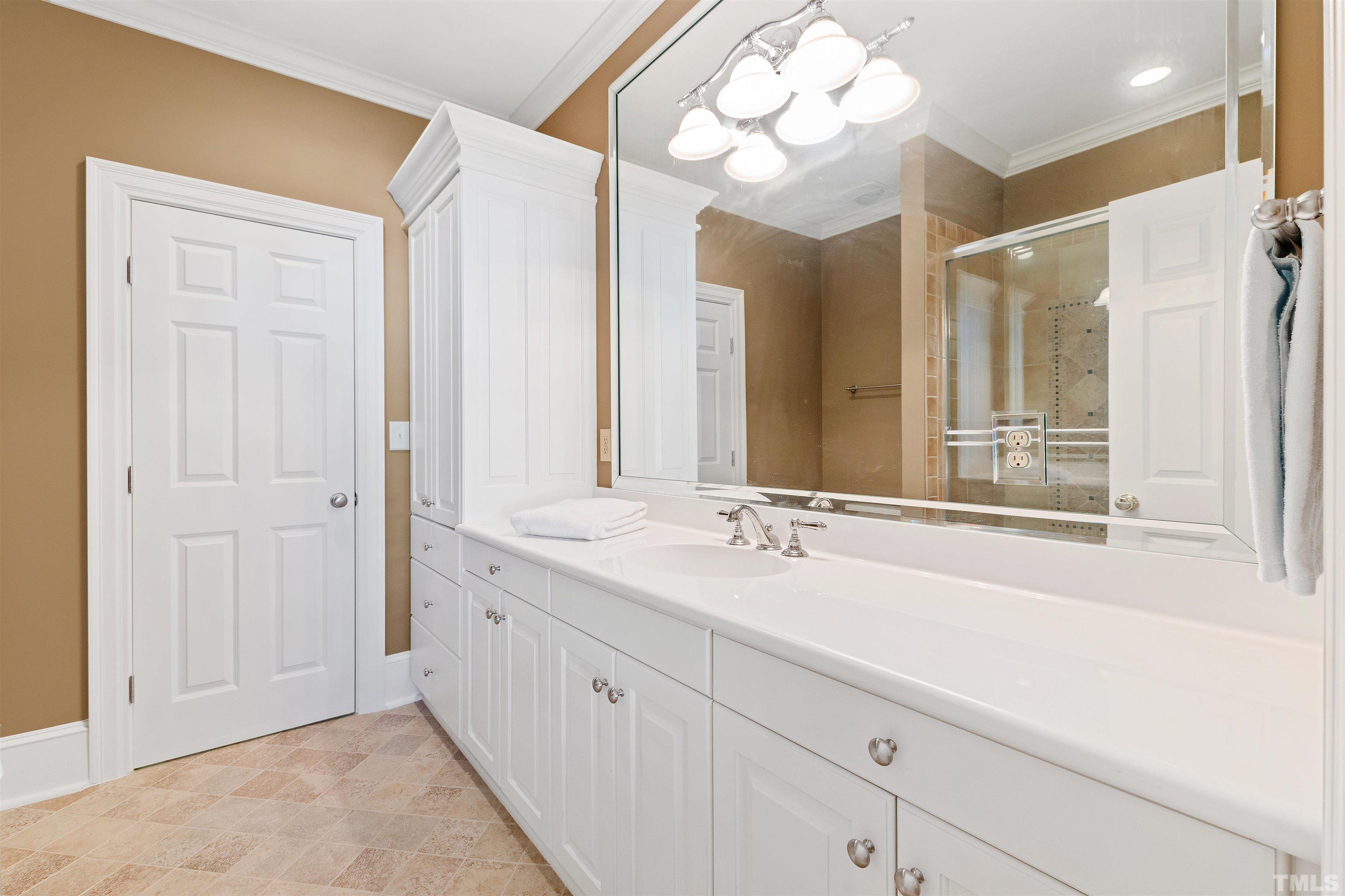 1029 Harvey Street Raleigh, NC 27608 - Photo 44 of 63 a bathroom with a sink and a mirror
