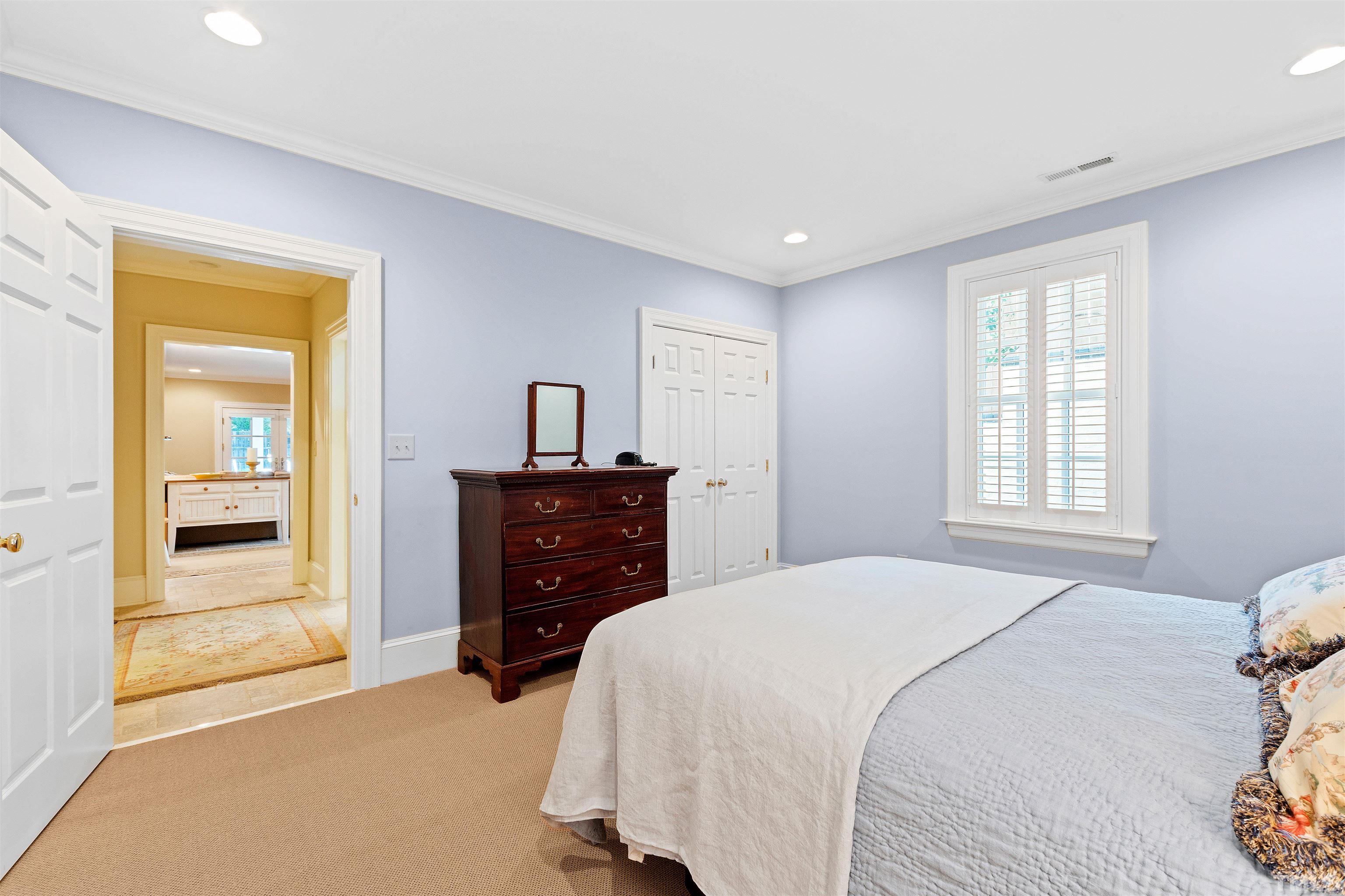 1029 Harvey Street Raleigh, NC 27608 - Photo 54 of 63 a bedroom with a bed and a dresser