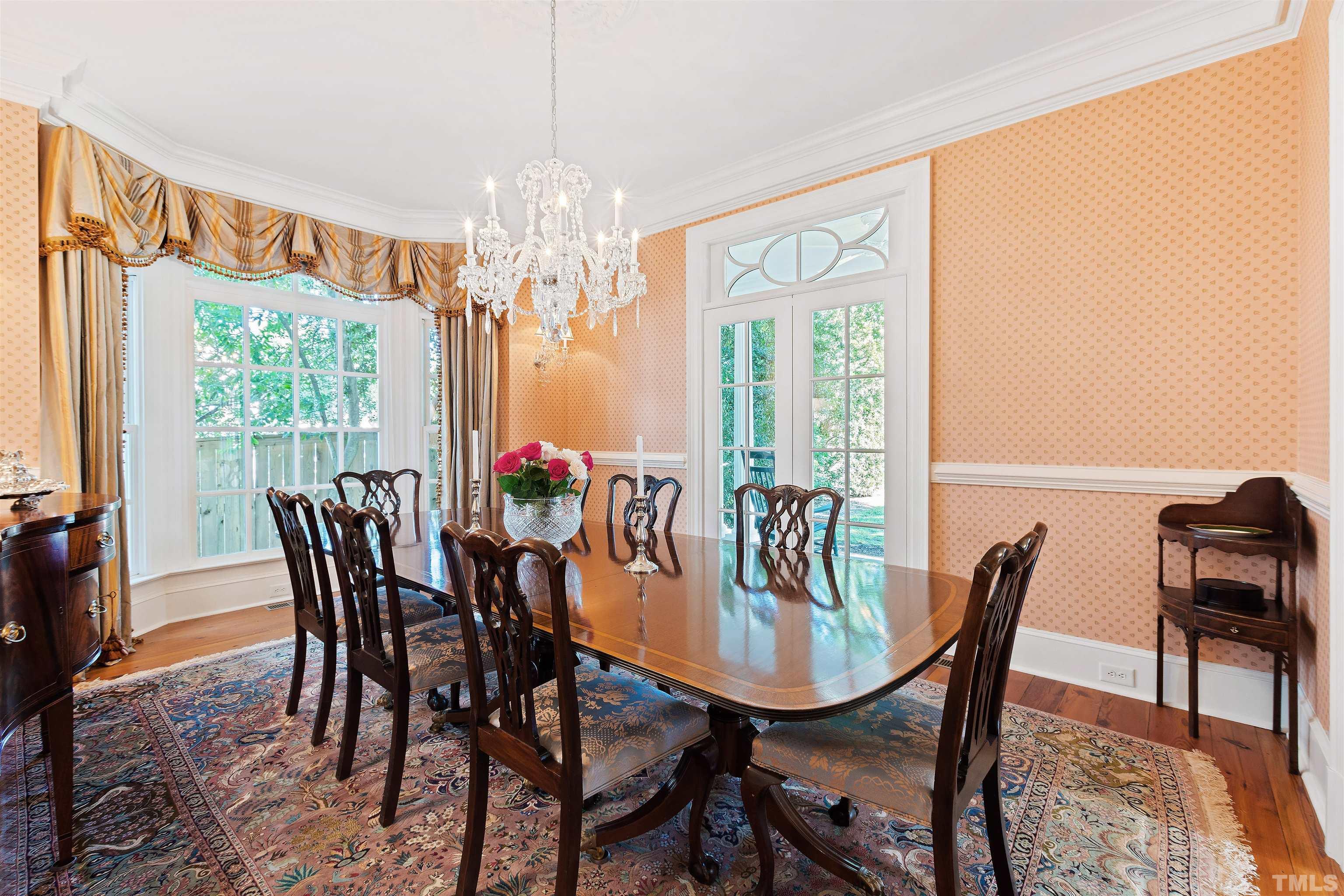 1029 Harvey Street Raleigh, NC 27608 - Photo 8 of 63 a dining room with furniture a chandelier and window