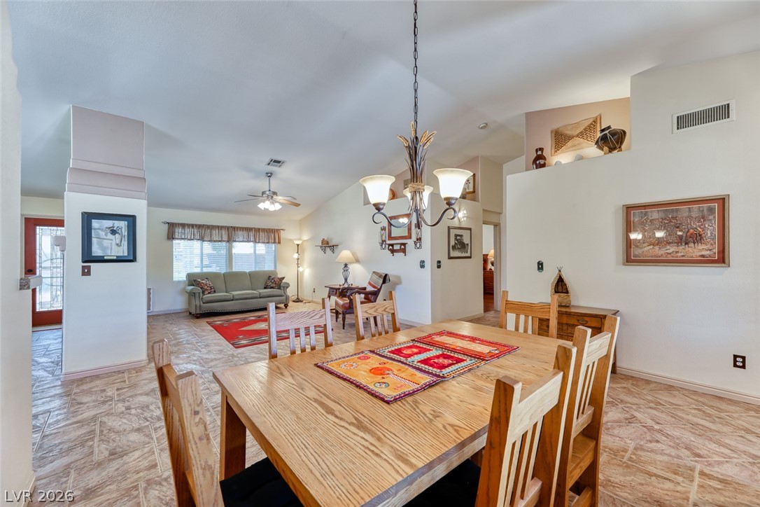 2001 Appaloosa Road Henderson, NV 89002 - Photo 26 of 44 This inviting space features an open layout connecting the dining area to a comfortable living room.